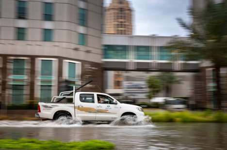 Car driving through floods in Dubai